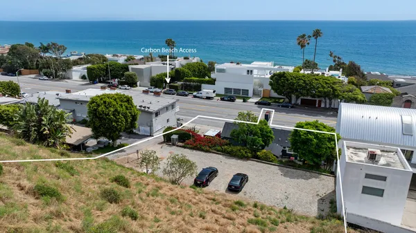 an aerial view of a house with outdoor space