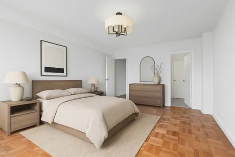 a bedroom with a bed and a painting on the wall