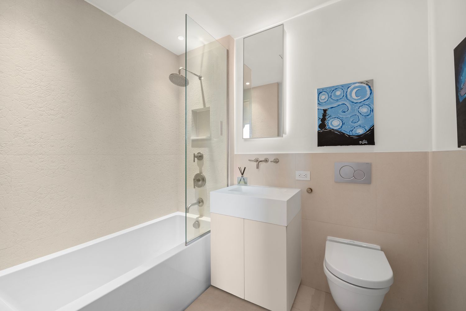 101 Wall Street, Unit 5BE Manhattan, NY 10005 - Photo 9 of 16 a bathroom with a toilet a sink and bathtub