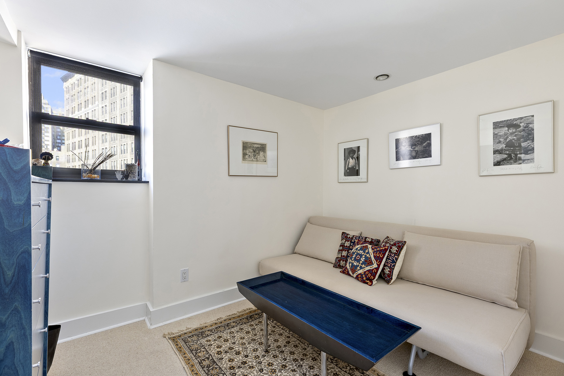 889 Broadway, Unit PHA Manhattan, NY 10003 - Photo 7 of 11 a living room with furniture and a window