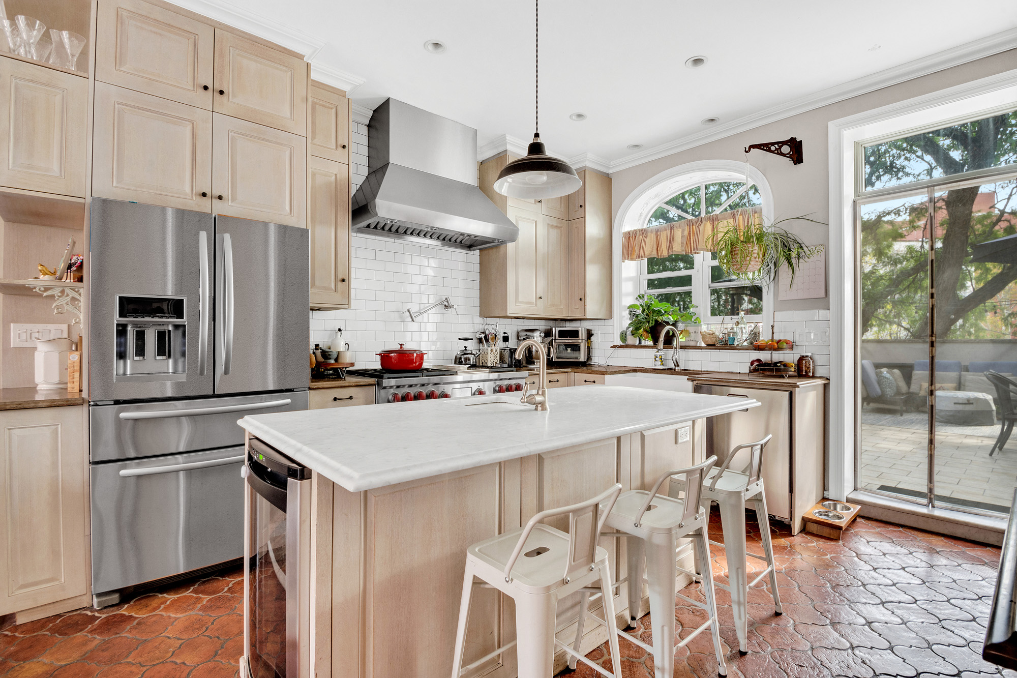 10 Carroll Street Brooklyn, NY 11231 - Photo 6 of 28 a kitchen with stainless steel appliances a sink a stove a refrigerator cabinets and wooden floor