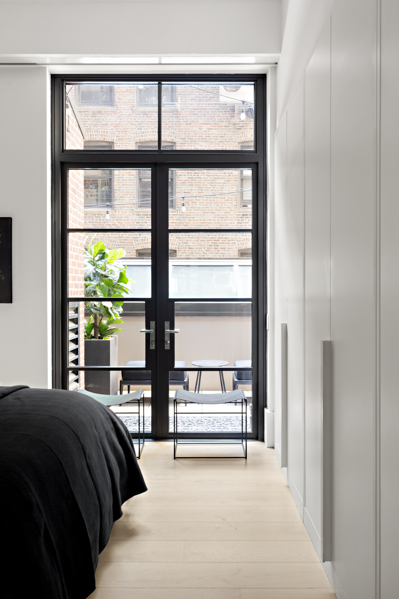 404 Park Avenue South, Unit 3E Manhattan, NY 10016 - Photo 12 of 21 a bedroom with a bed and a large window