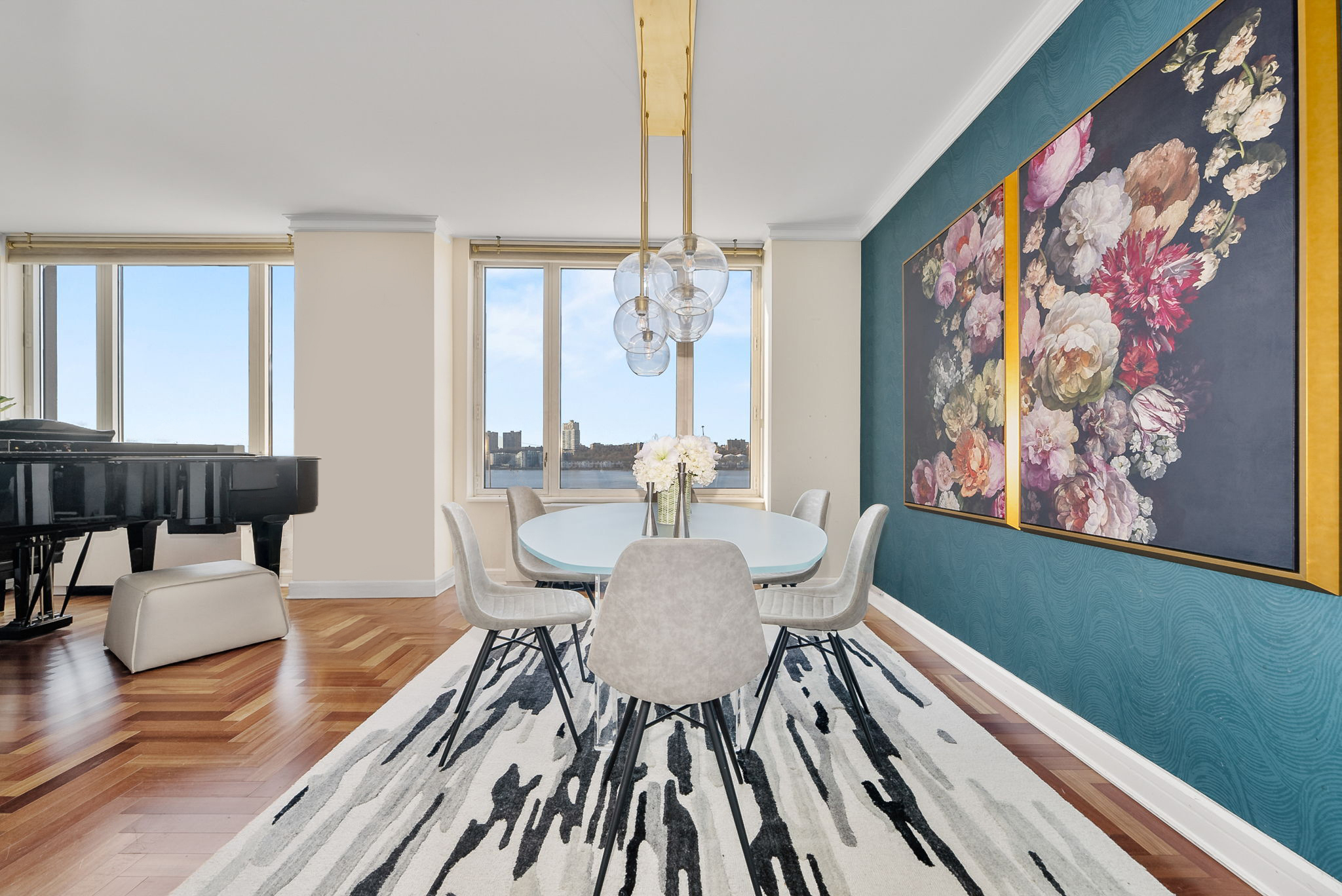 220 Riverside Boulevard, Unit 4M Manhattan, NY 10069 - Photo 4 of 11 a view of a dining room with furniture window and wooden floor
