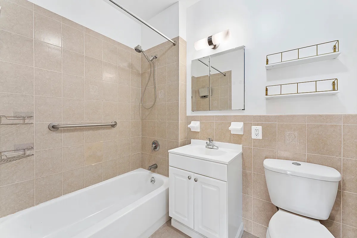 115 South 8th Street, Unit 2 Brooklyn, NY 11249 - Photo 4 of 5 a bathroom with a toilet sink and bathtub