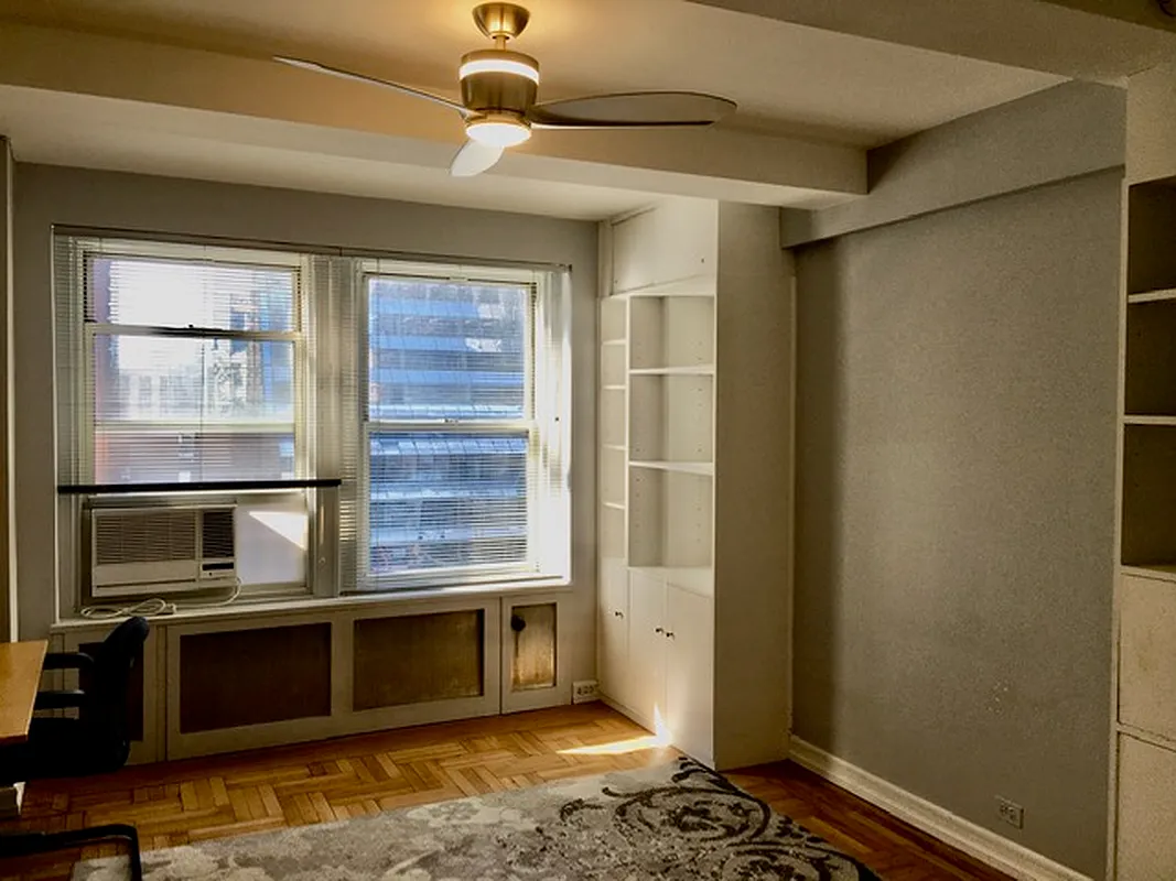 433 West 34th Street, Unit 7B Manhattan, NY 10001 - Photo 1 of 13 a living room with stainless steel appliances kitchen island granite countertop a refrigerator stove and microwave