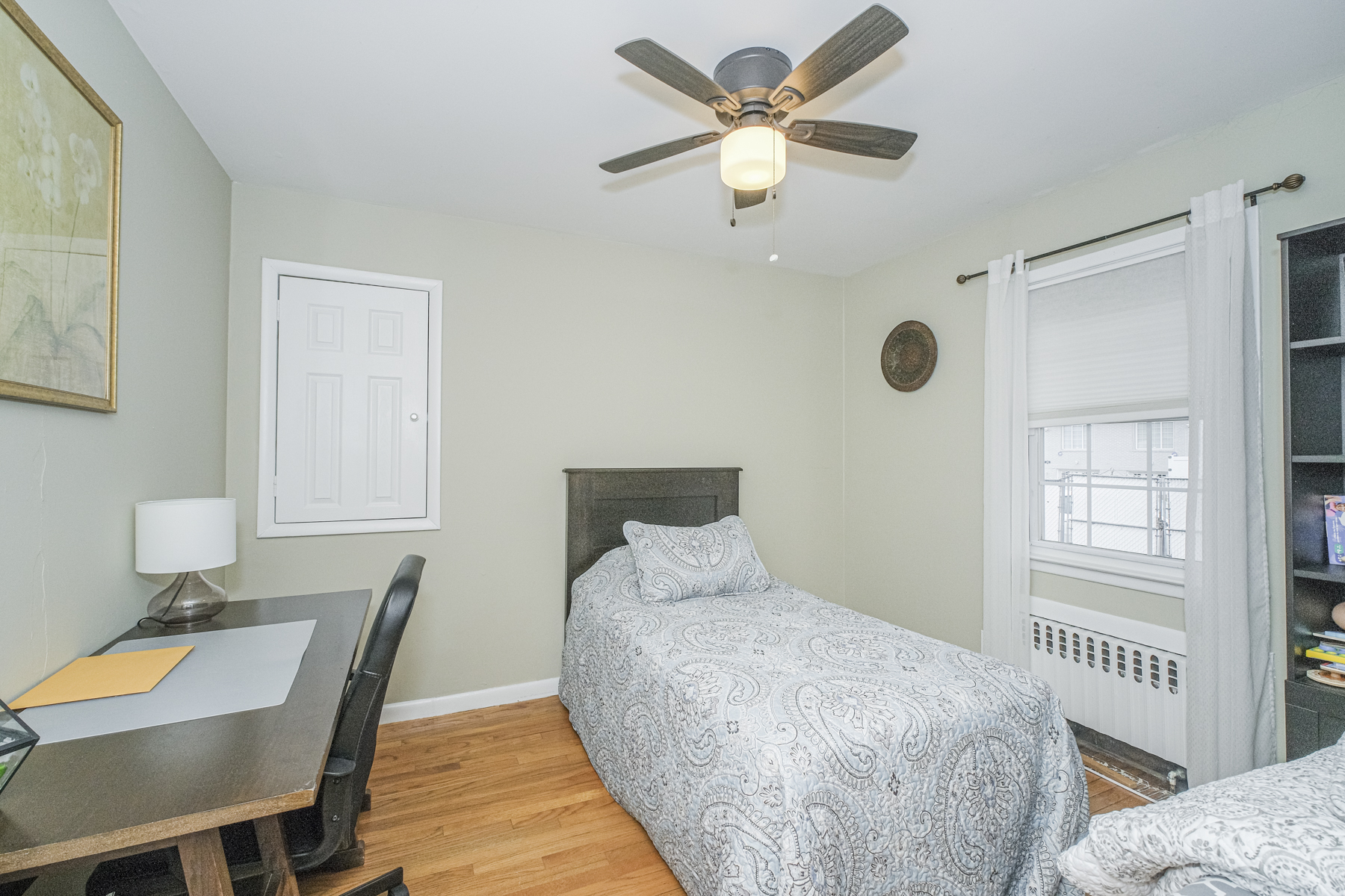 503 Falcon Avenue Staten Island, NY 10306 - Photo 15 of 30 a bedroom with a bed and a table in it