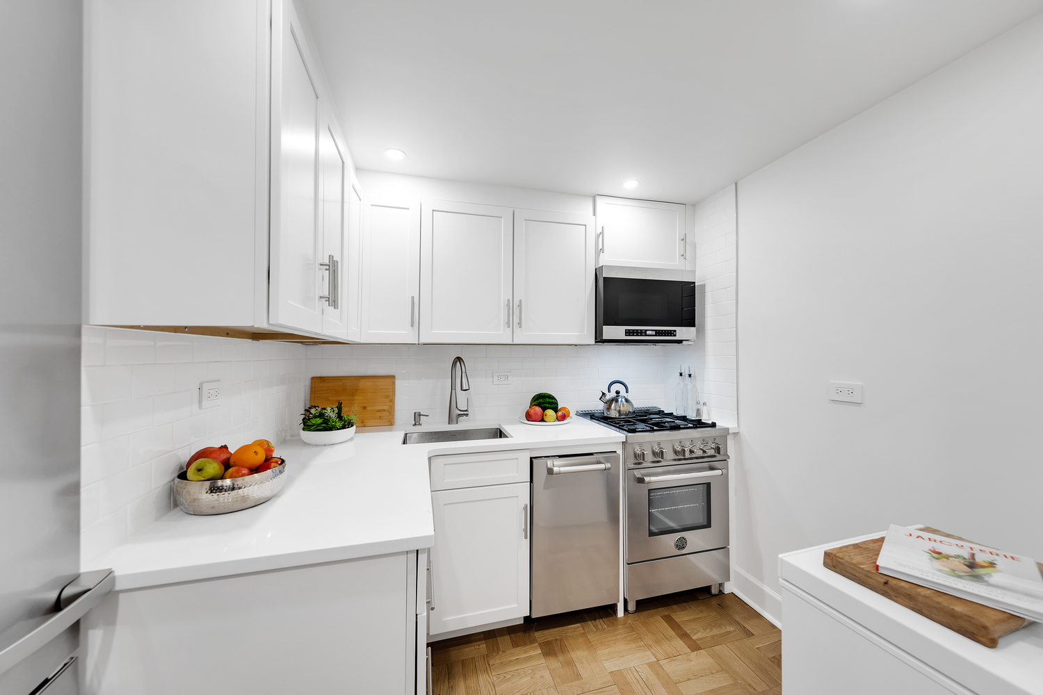 40 East 80th Street, Unit 2C Manhattan, NY 10075 - Photo 2 of 6 a view of a kitchen with appliances and cabinets