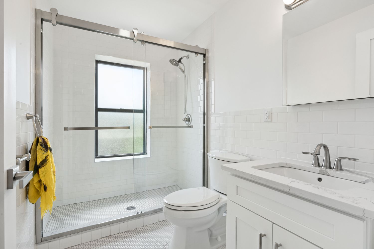 692 Putnam Avenue, Unit 2 Brooklyn, NY 11221 - Photo 3 of 15 a bathroom with a sink toilet and shower