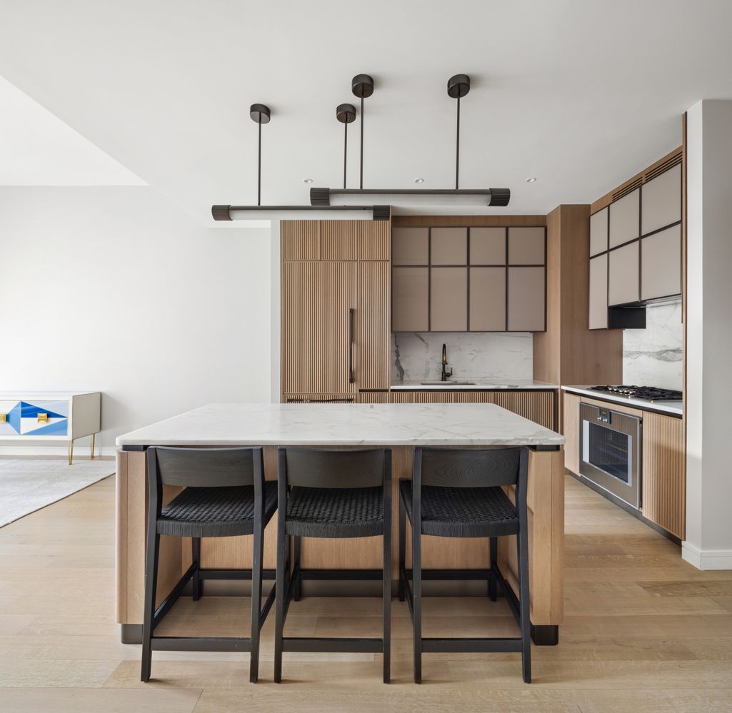 a kitchen with a table and chairs in it