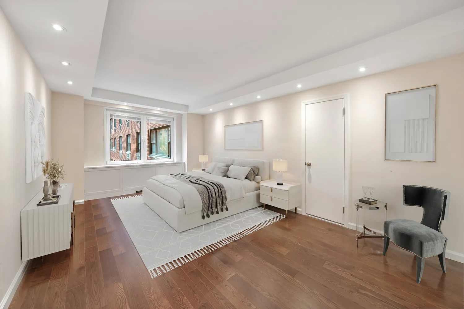 a spacious bedroom with a bed and a couch