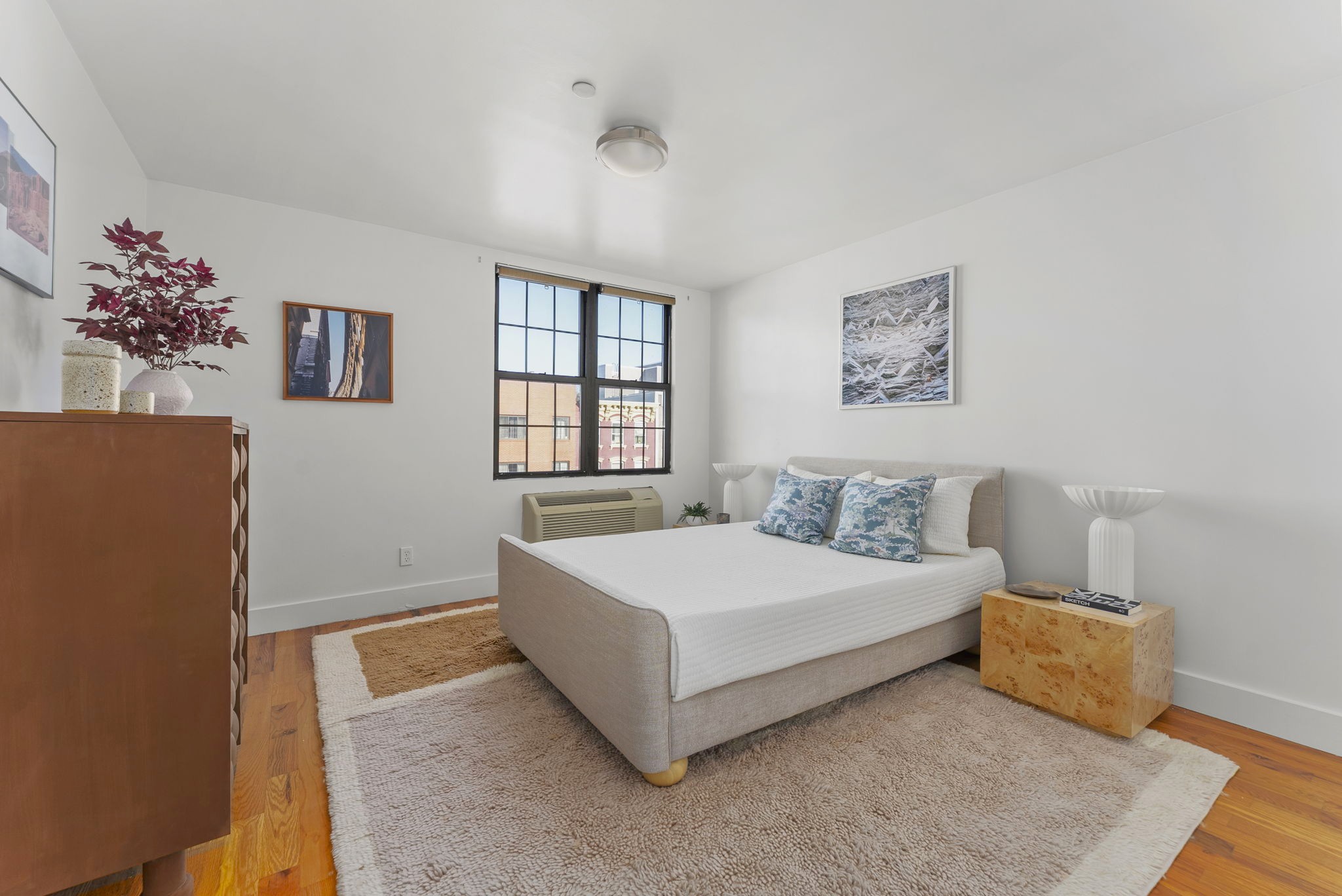 120 Pulaski Street, Unit 3A Brooklyn, NY 11206 - Photo 8 of 13 a spacious bedroom with a bed and a couch