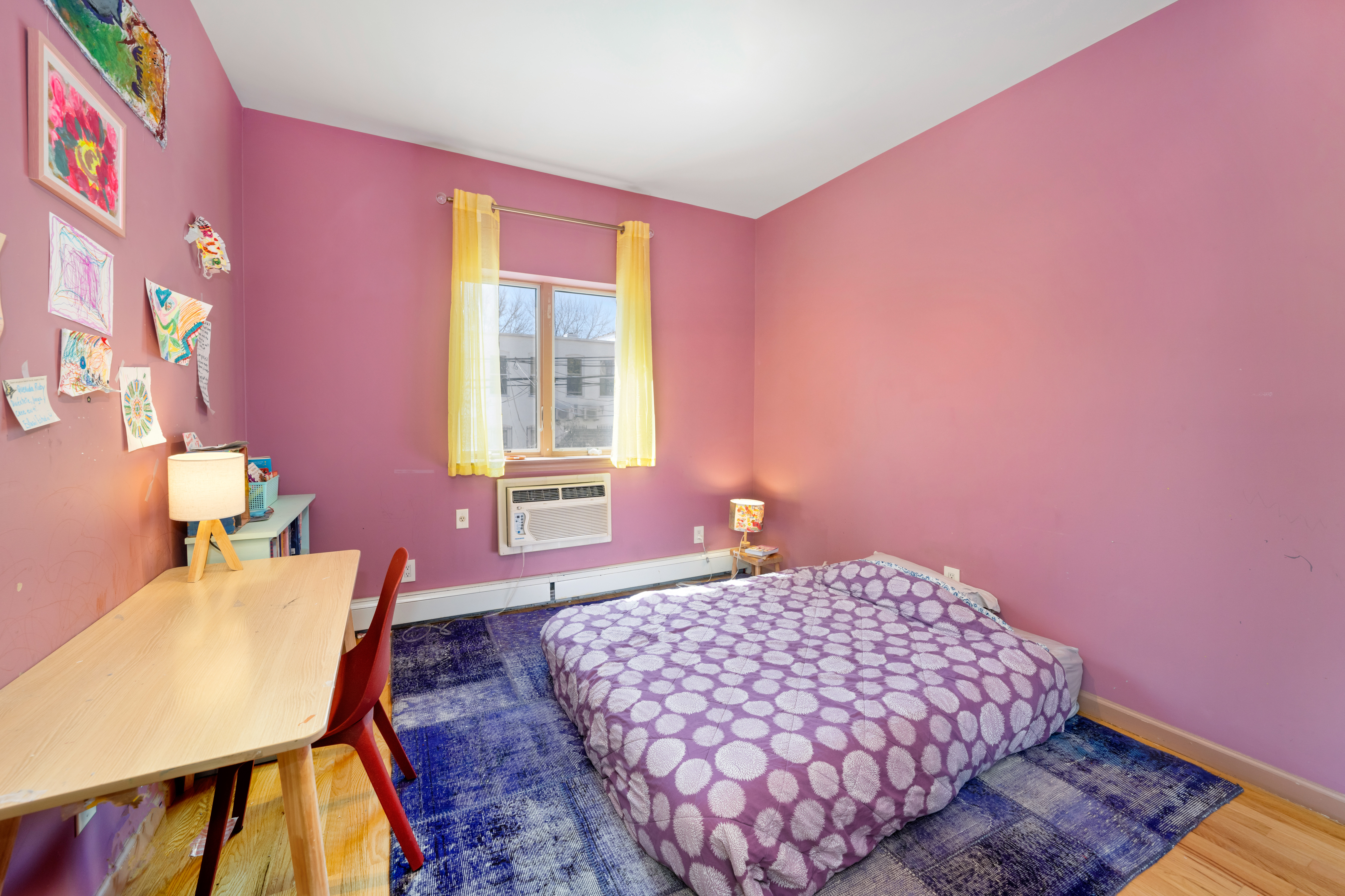 2356 61st Street, Unit 1B Brooklyn, NY 11204 - Photo 8 of 10 a bedroom with a bed and wooden floor