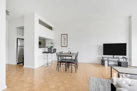 a workspace with furniture and a flat screen tv