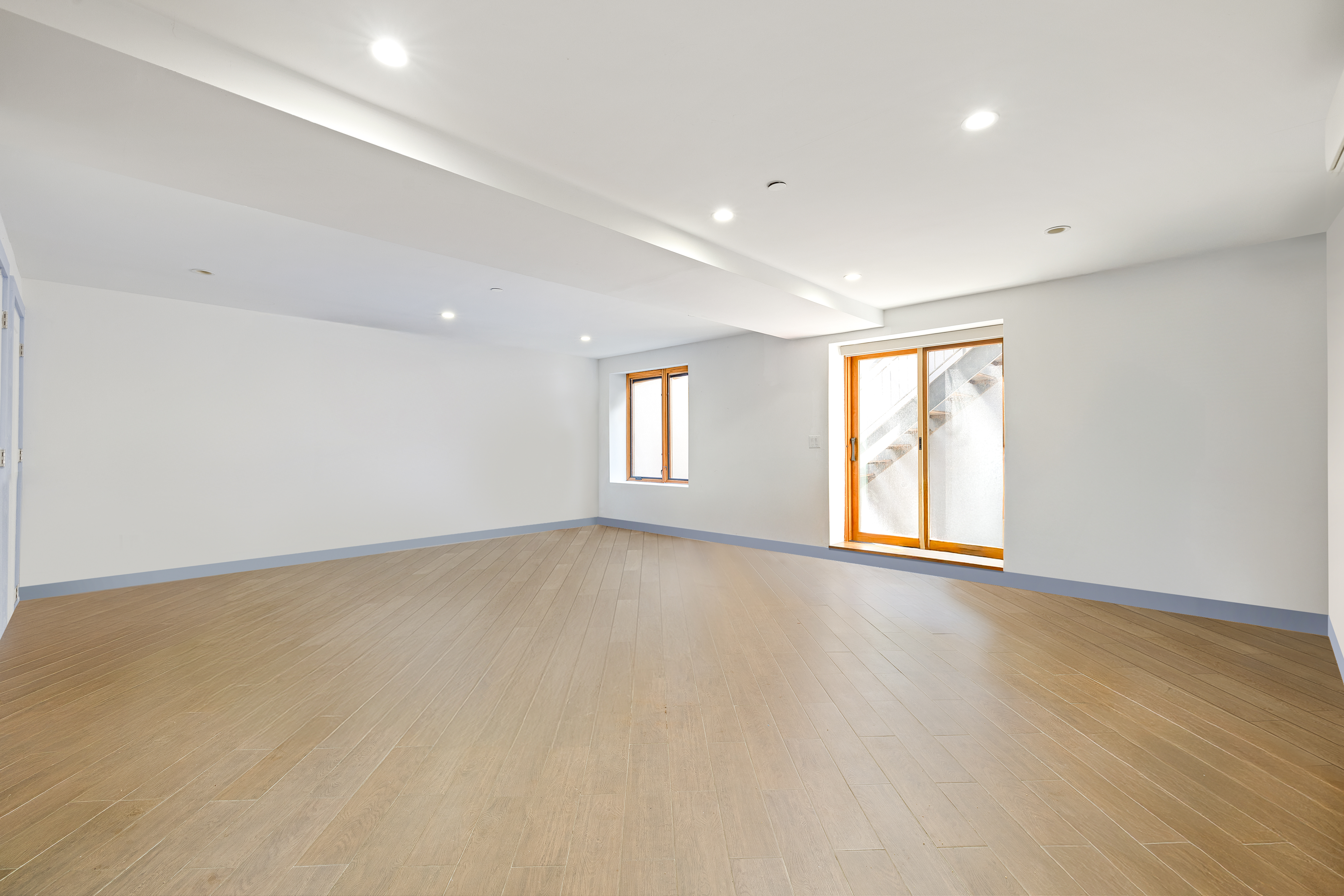 Saint Marks Avenue Brooklyn, NY 11213 - Photo 9 of 16 an empty room with wooden floor and windows
