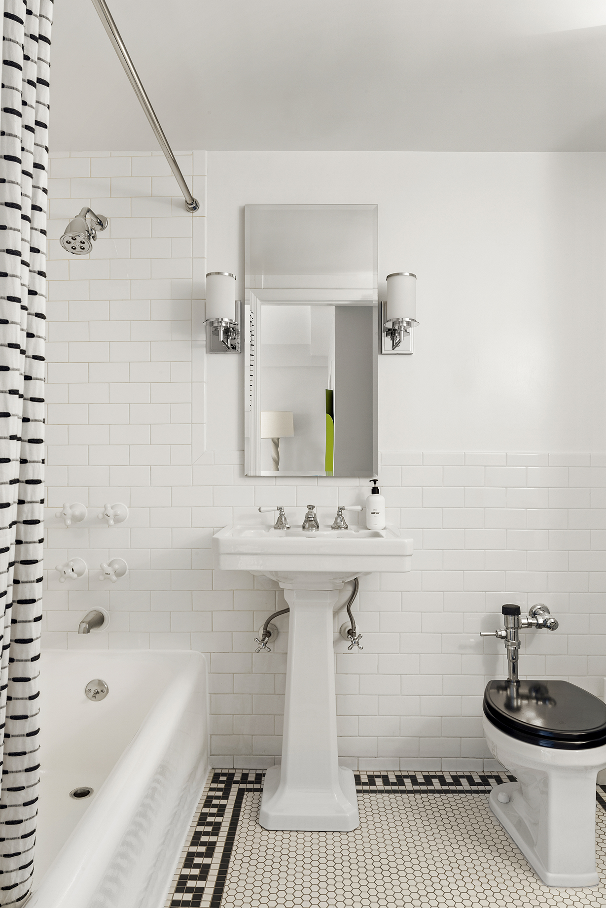 161 West 16th Street, Unit 6E Manhattan, NY 10011 - Photo 9 of 15 a bathroom with a sink a bathtub and a mirror