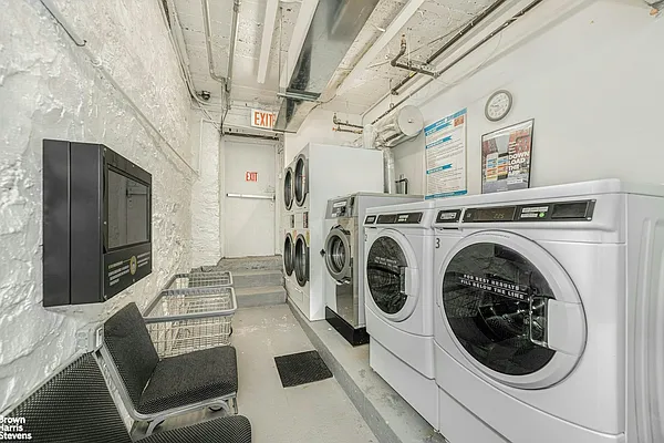225 Bennett Avenue, Unit 5H Manhattan, NY 10040 - Photo 7 of 10 a view of a washer and dryer in a utility room