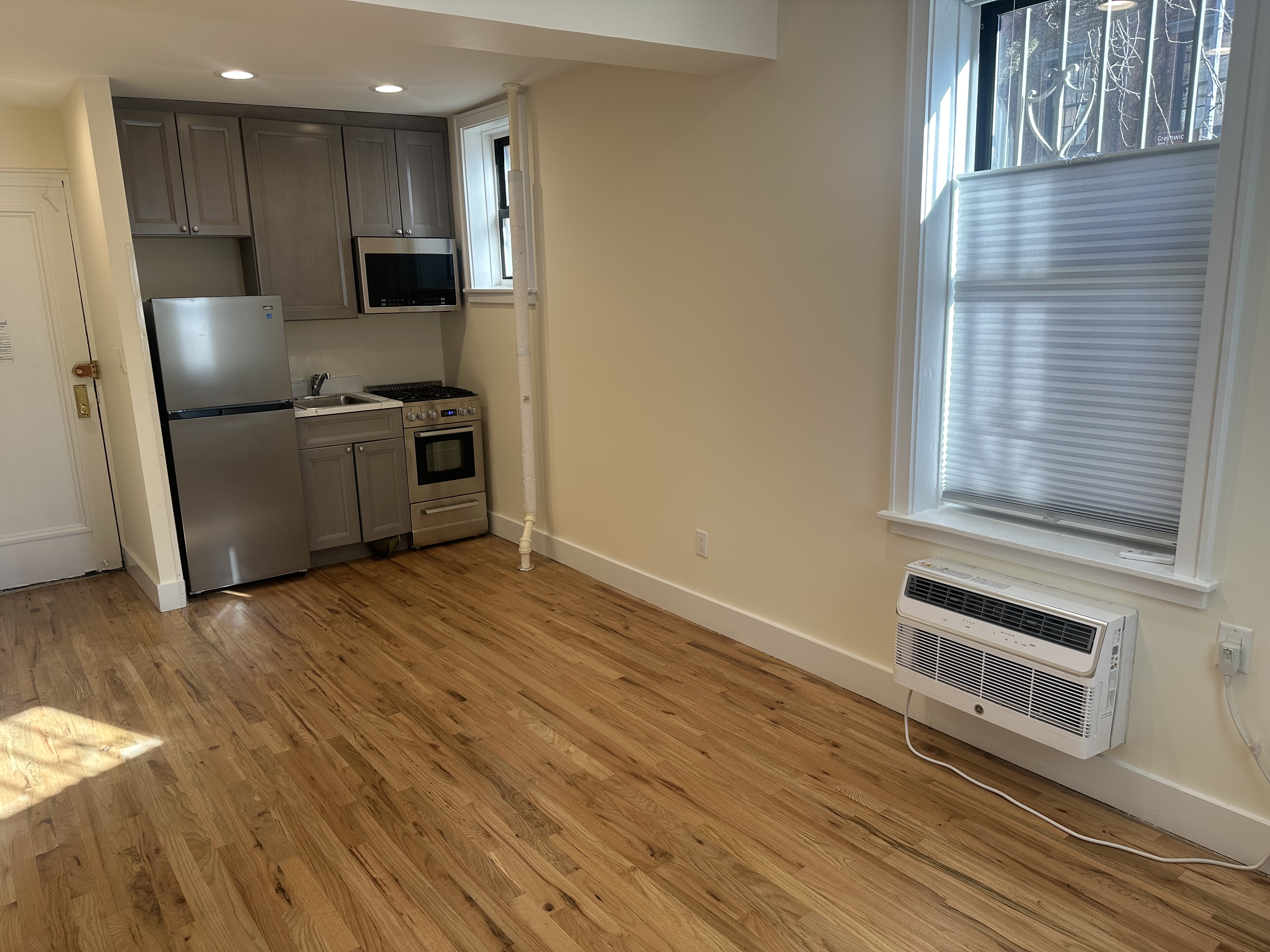 752 Greenwich Street, Unit 1A/B Manhattan, NY 10014 - Photo 3 of 12 a kitchen with stainless steel appliances a refrigerator and a stove top oven