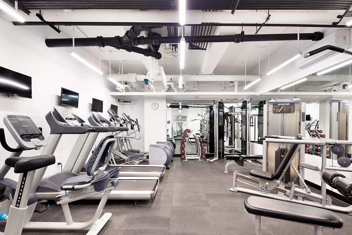 36 Sutton Place South, Unit 11D Manhattan, NY 10022 - Photo 8 of 11 a view of a room with gym equipment