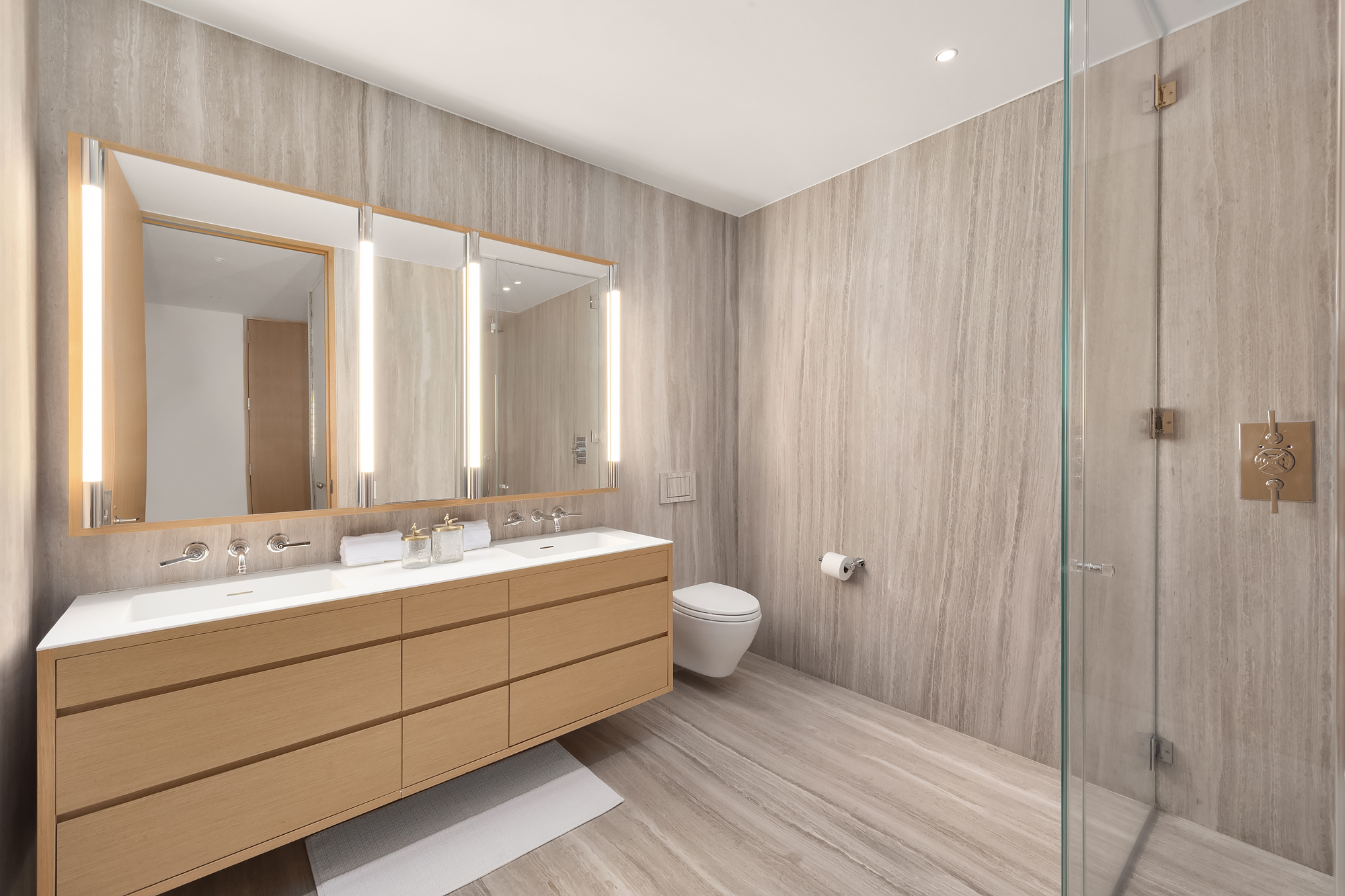 71 Reade Street, Unit 4D Manhattan, NY 10007 - Photo 10 of 15 a bathroom with a double vanity sink and a mirror