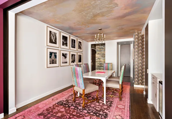 a dining room with a table and chairs