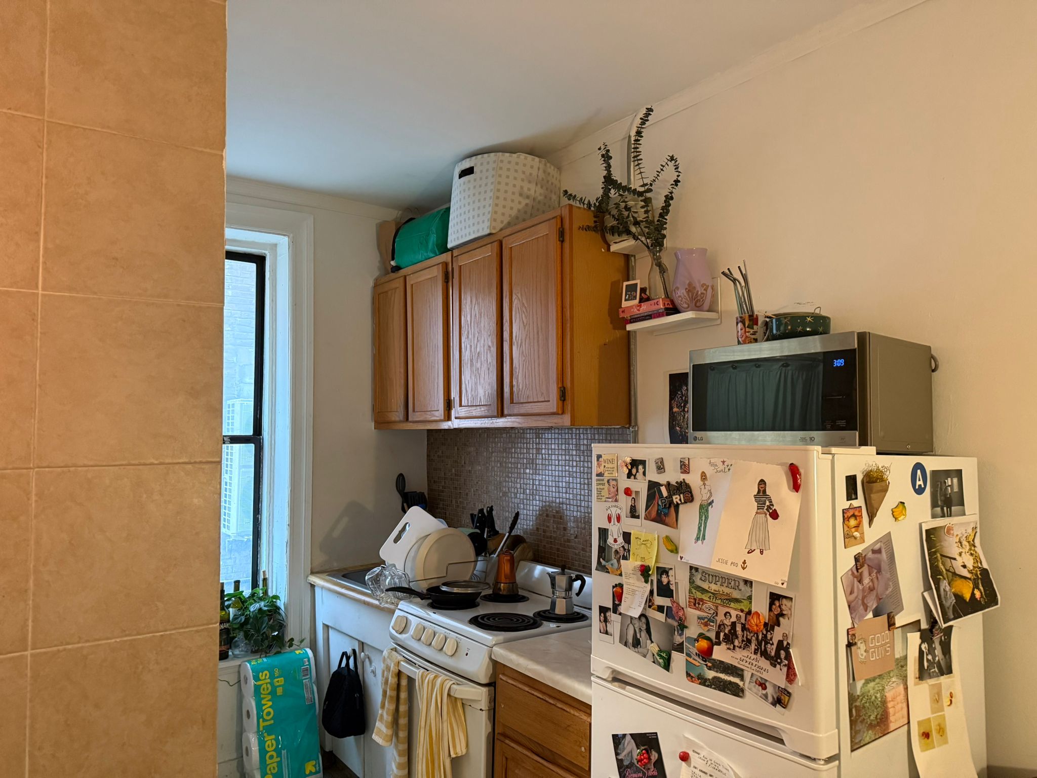 1278 1st Avenue, Unit 2 Manhattan, NY 10065 - Photo 7 of 19 a kitchen with stainless steel appliances granite countertop a stove and a sink