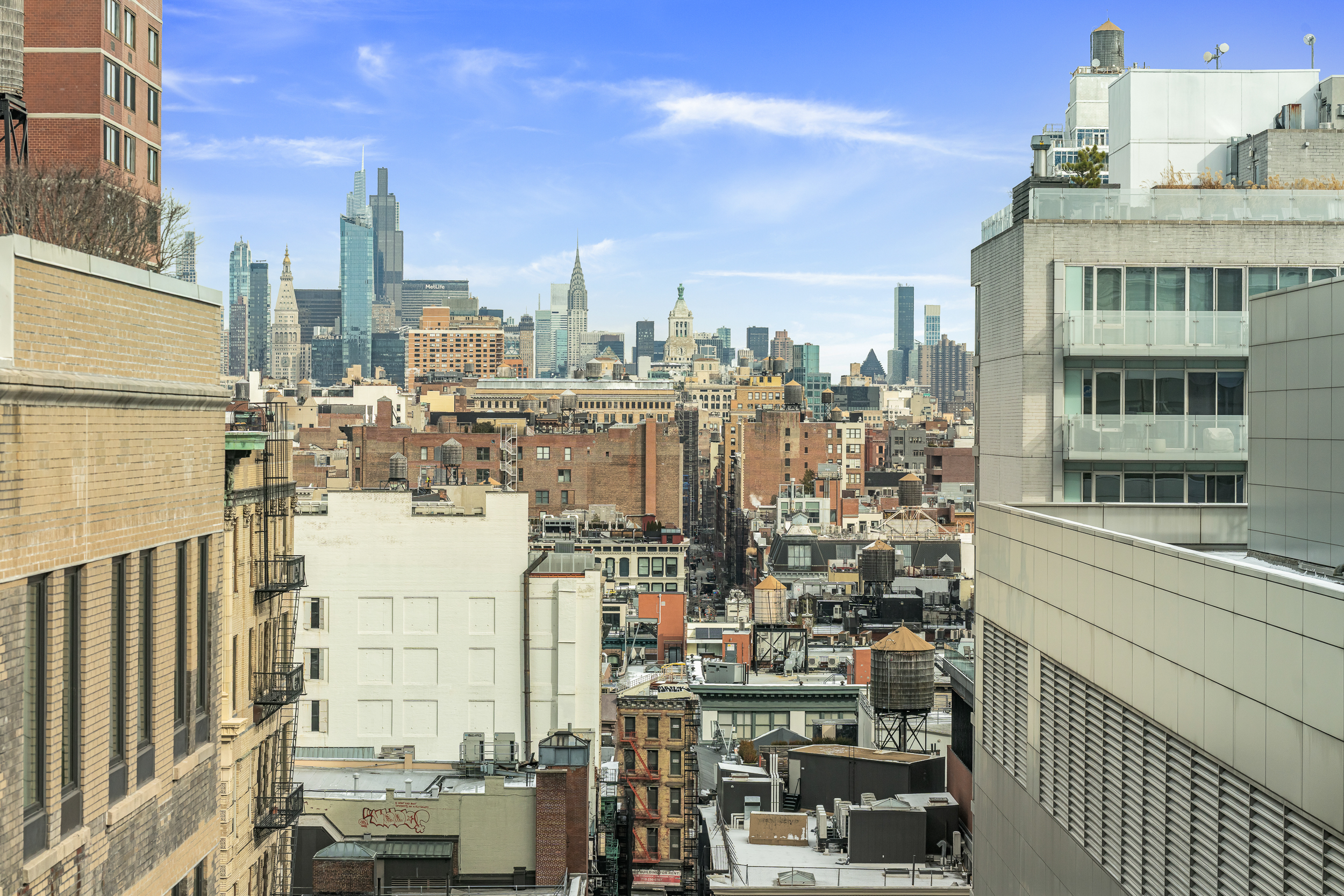 108 Leonard Street, Unit 12F Manhattan, NY 10013 - Photo 5 of 15 a view of city with tall buildings