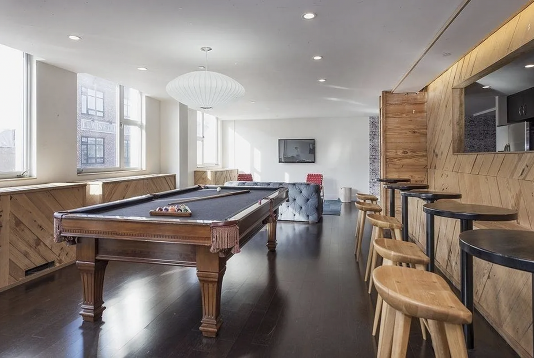 250 Bedford Avenue, Unit 129211 Brooklyn, NY 11249 - Photo 5 of 6 a room with wooden floor table and chairs