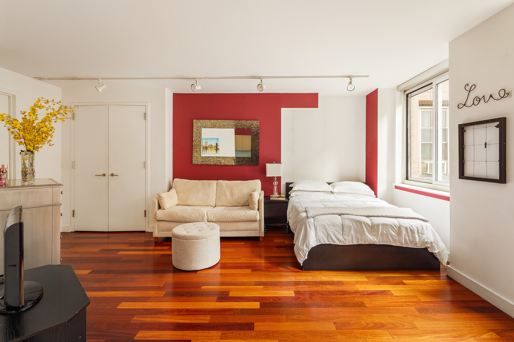 a bedroom with a bed and a fireplace