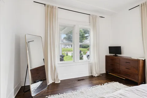 a room with a bed and a window