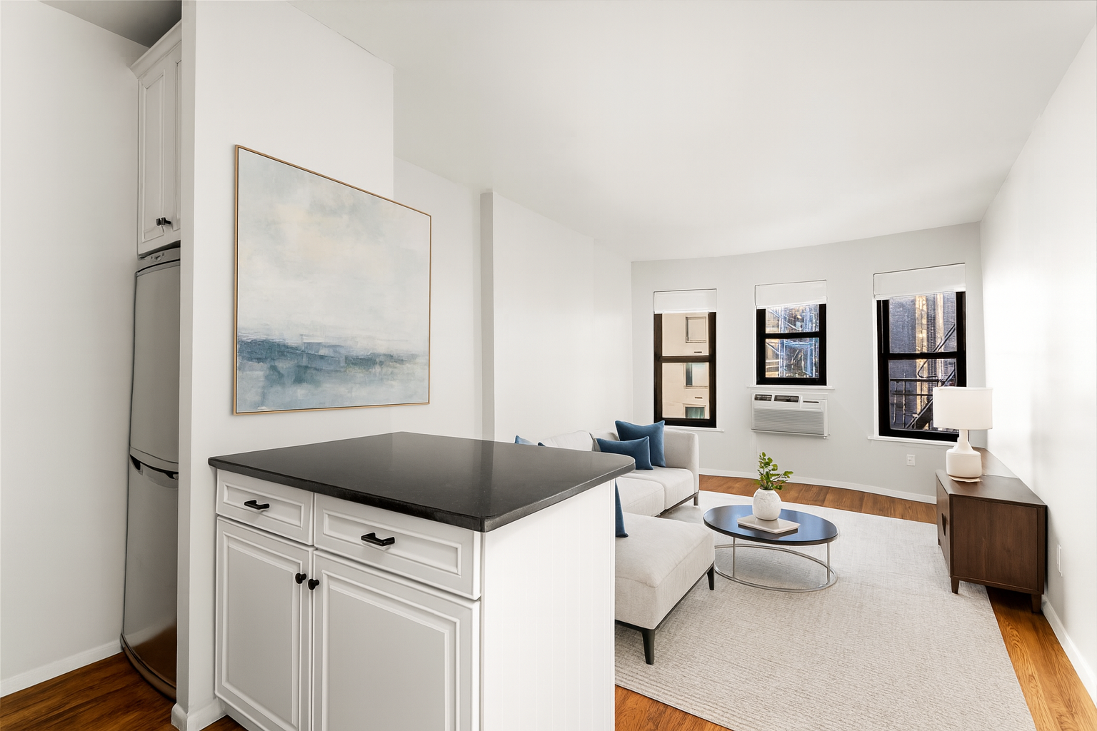 160 East 91st Street, Unit 7N Manhattan, NY 10128 - Photo 7 of 13 a living room with furniture and a window