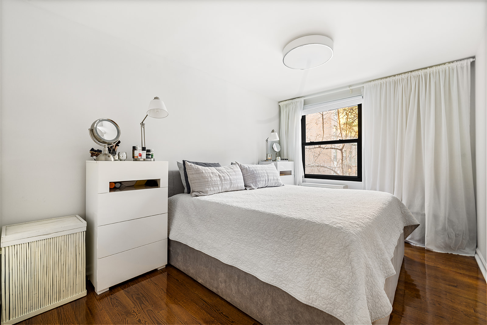 376 West Street, Unit 1A Manhattan, NY 10014 - Photo 5 of 11 a bedroom with a bed and a window