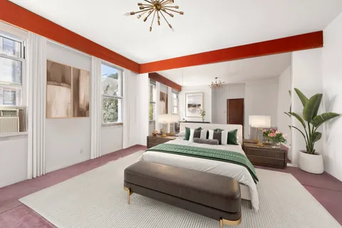 a spacious bedroom with a large bed a potted plant and attached