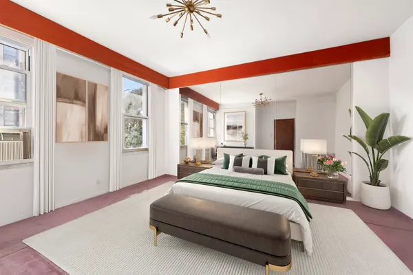 a spacious bedroom with a large bed a potted plant and attached