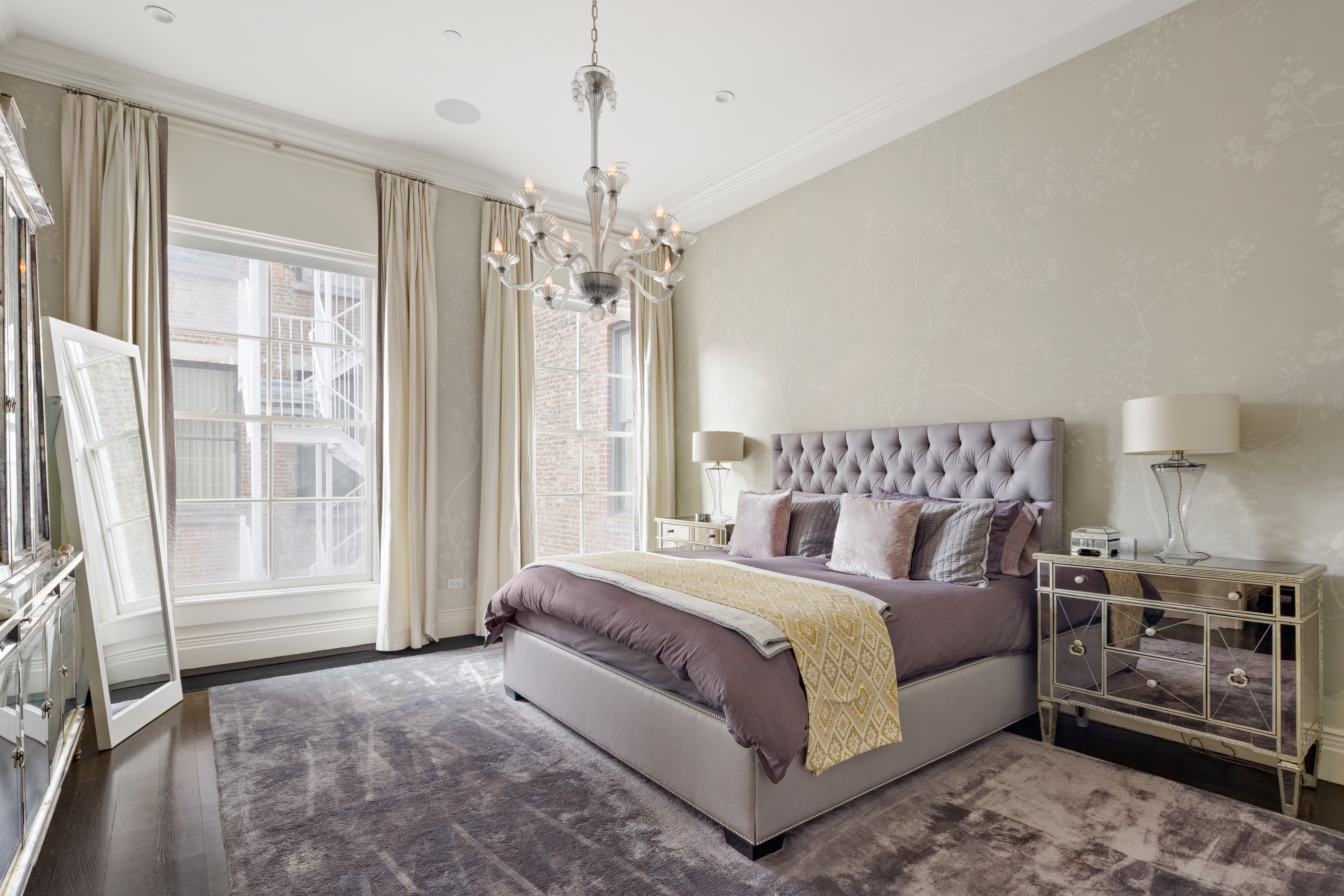 30 Crosby Street, Unit 5B Manhattan, NY 10013 - Photo 10 of 19 a spacious bedroom with a bed and wooden floor