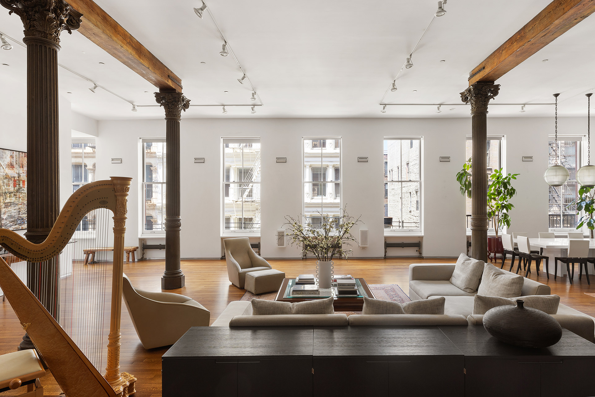 84 Mercer Street, Unit 3E Manhattan, NY 10012 - Photo 2 of 19 a view of a dining room with furniture window and wooden floor