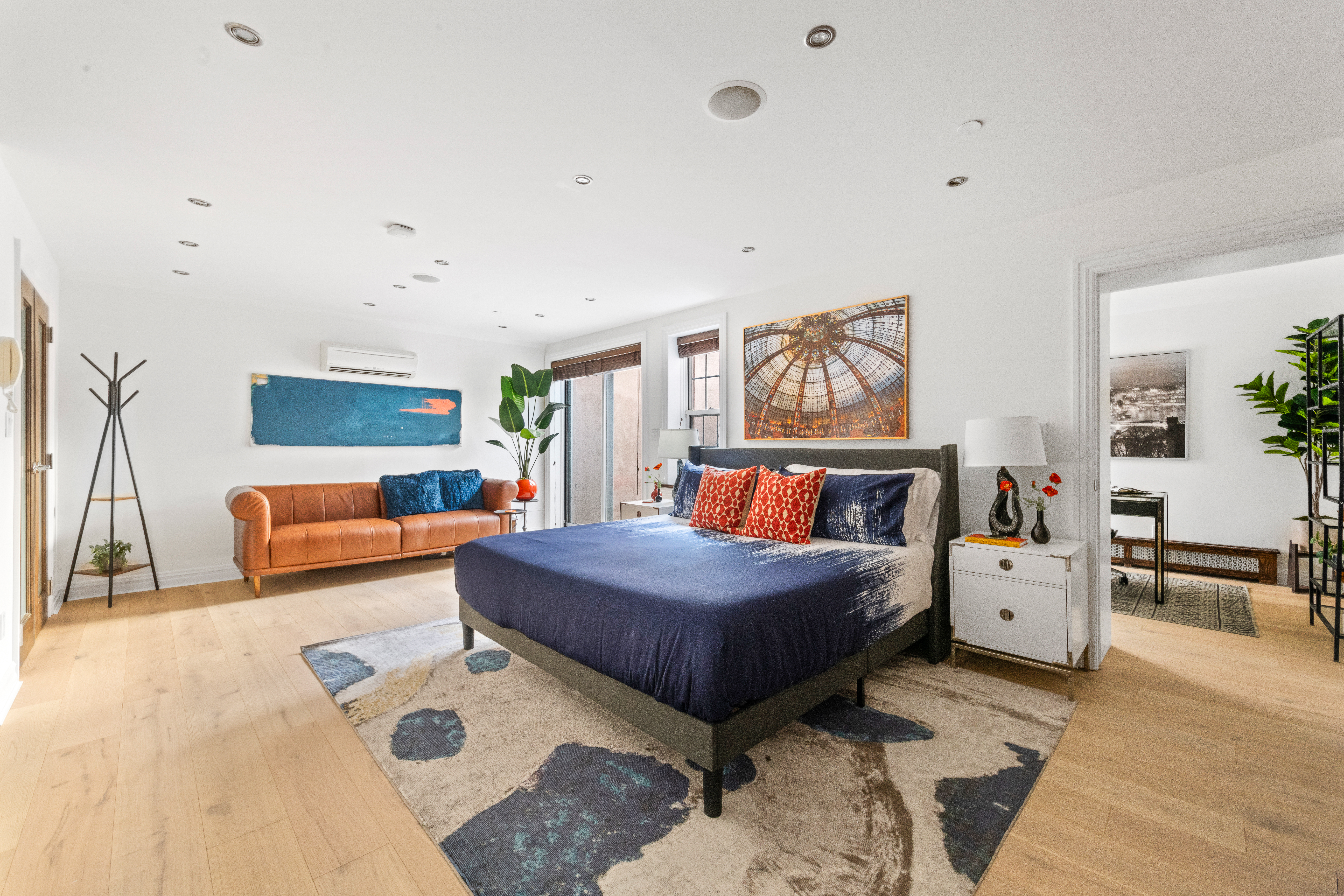 37 Powers Street, Unit 1A Brooklyn, NY 11211 - Photo 4 of 9 a bedroom with a large bed and a couch