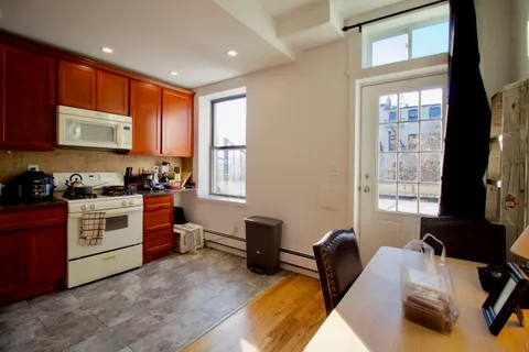 a living room with furniture window and wooden floor