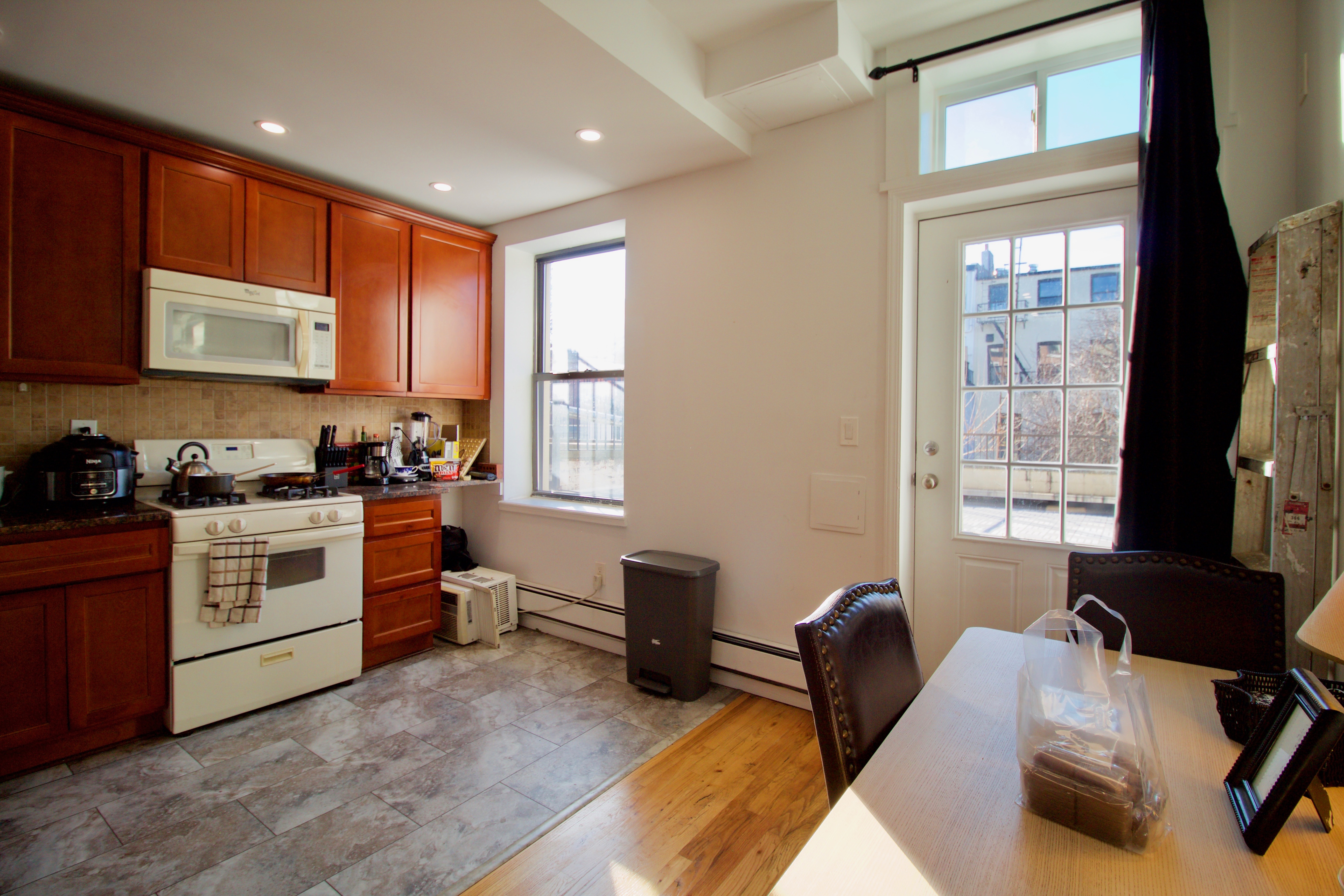 134 Union Street, Unit 2R Brooklyn, NY 11231 - Photo 25 of 37 a kitchen with stainless steel appliances granite countertop a stove top oven a sink dishwasher and cabinets with wooden floor