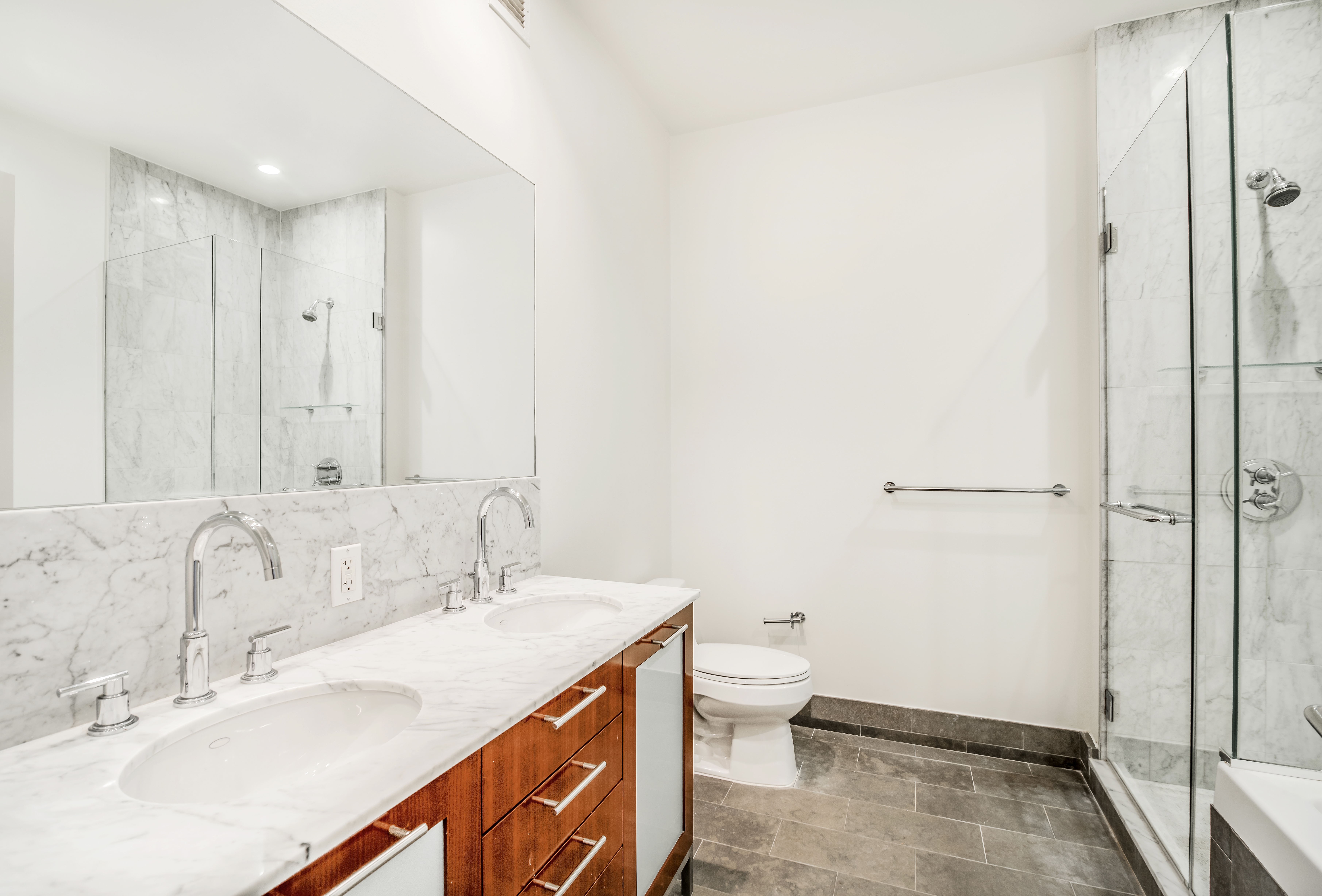 100 Jay Street, Unit 26B Brooklyn, NY 11201 - Photo 10 of 15 a bathroom with a granite countertop sink and a mirror