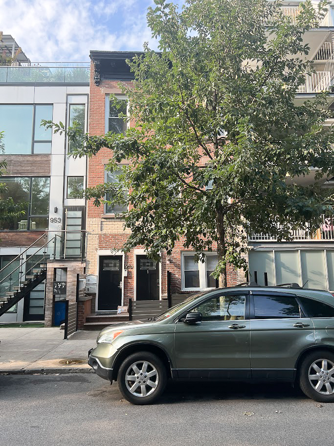 955 Pacific Street, Unit 1 Brooklyn, NY 11238 - Photo 11 of 12 a view of a car parked in front of a house