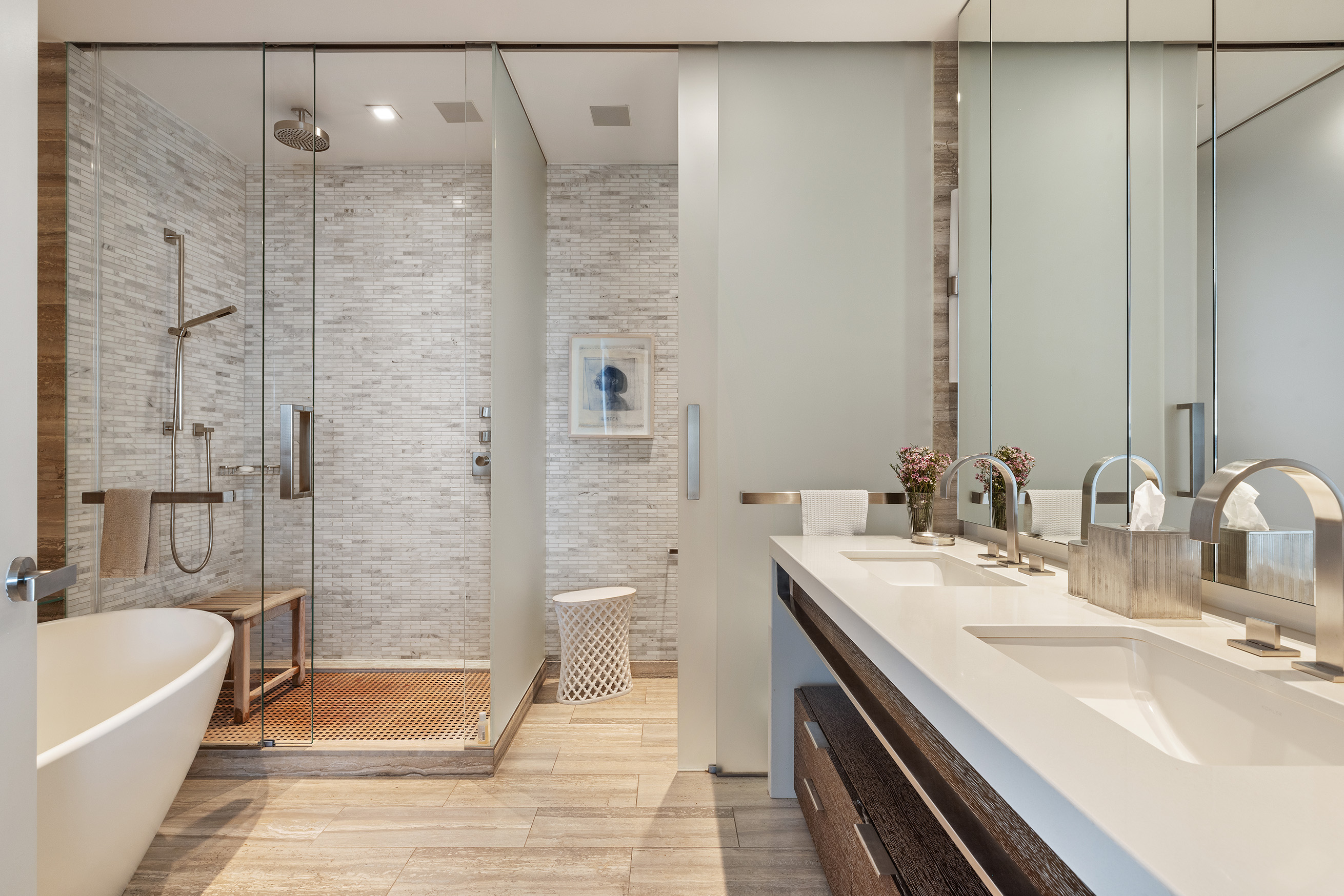 400 West 12th Street, Unit 12C Manhattan, NY 10014 - Photo 13 of 24 a bathroom with a tub sink shower and two mirror