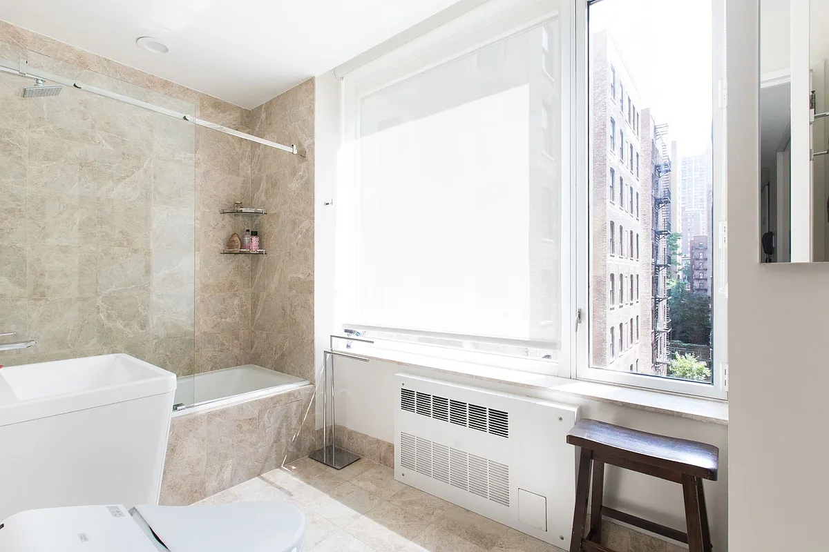 220 Riverside Boulevard, Unit 4D Manhattan, NY 10069 - Photo 10 of 15 a bathroom with a sink a toilet and a shower