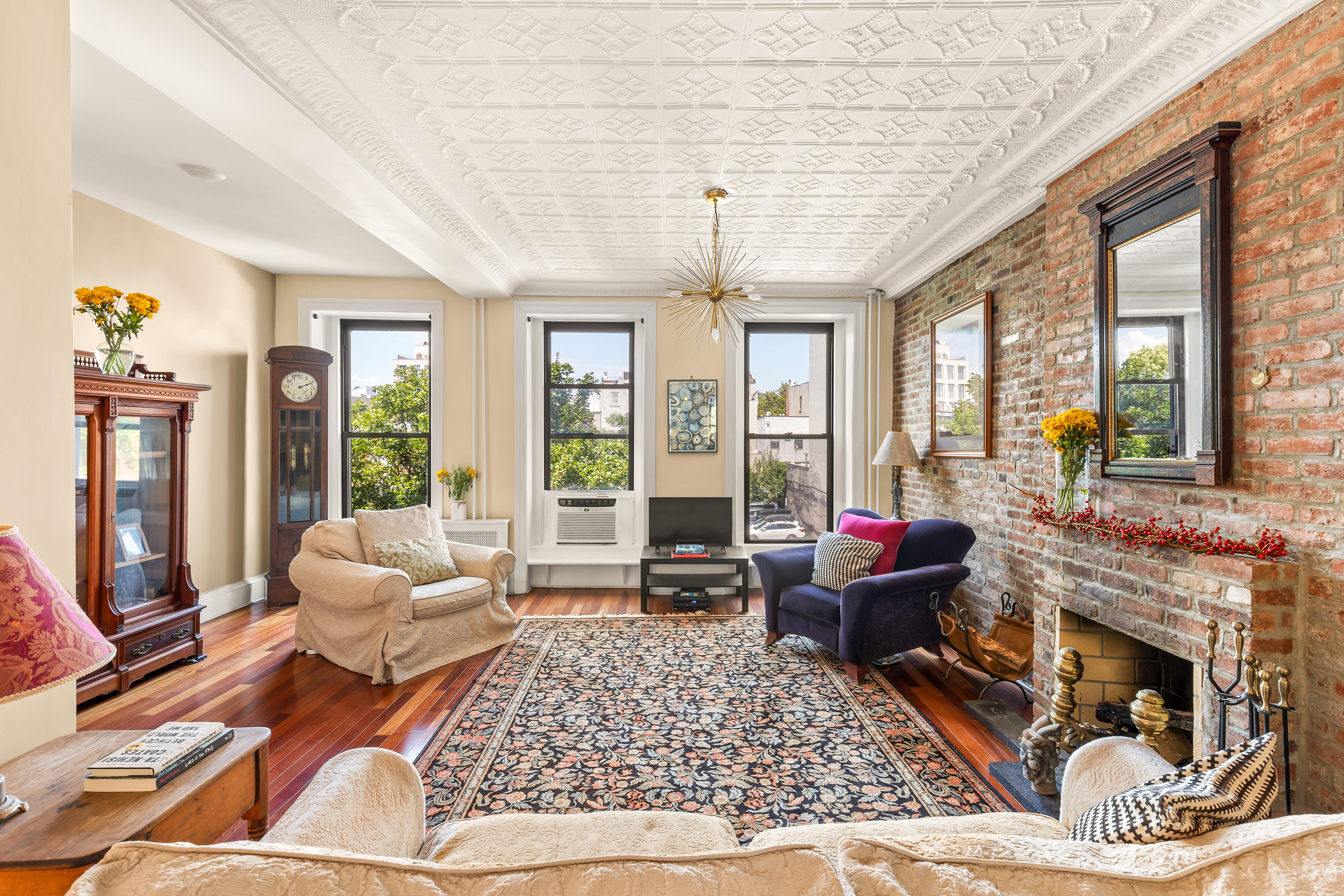 124 Carroll Street, Unit 2 Brooklyn, NY 11231 - Photo 1 of 13 a living room with furniture large windows and wooden floor