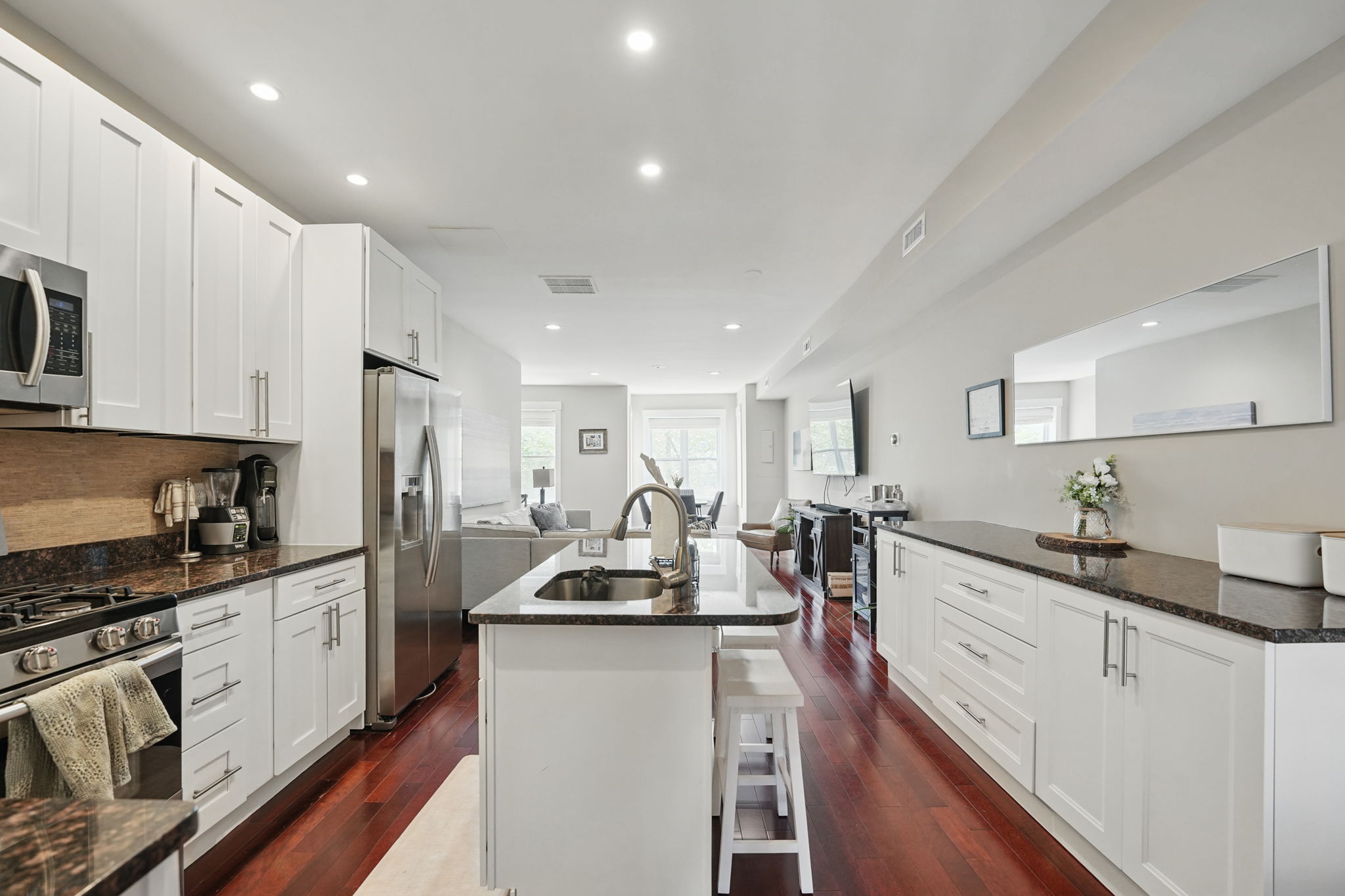 28 Q Street Northeast, Unit 2 Washington, DC 20002 - Photo 13 of 41 a kitchen with sink a stove and cabinets