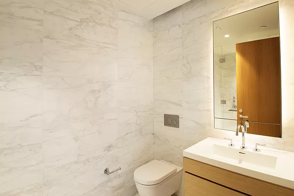 565 Broome Street, Unit N6J Manhattan, NY 10013 - Photo 9 of 27 a bathroom with a sink a toilet and shower