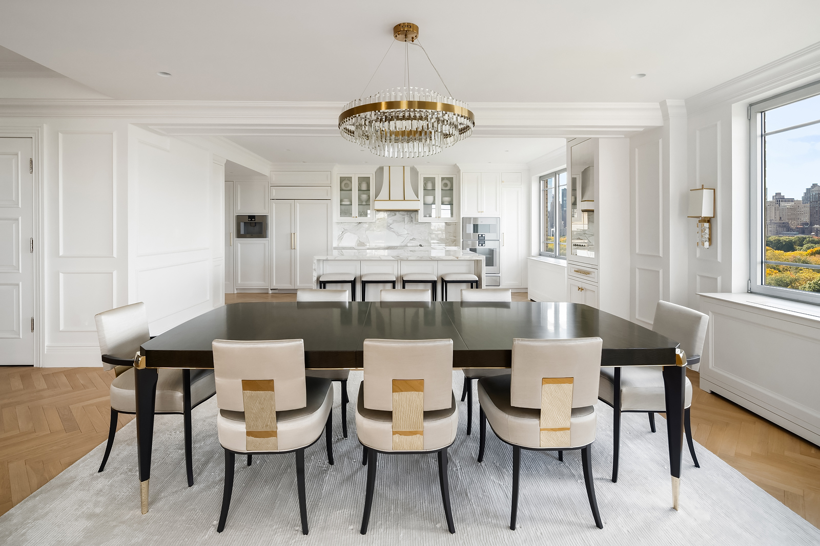930 5th Avenue, Unit 18A Manhattan, NY 10021 - Photo 3 of 16 a view of a dining room with furniture and chandelier