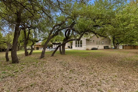 a view of swimming pool with chairs