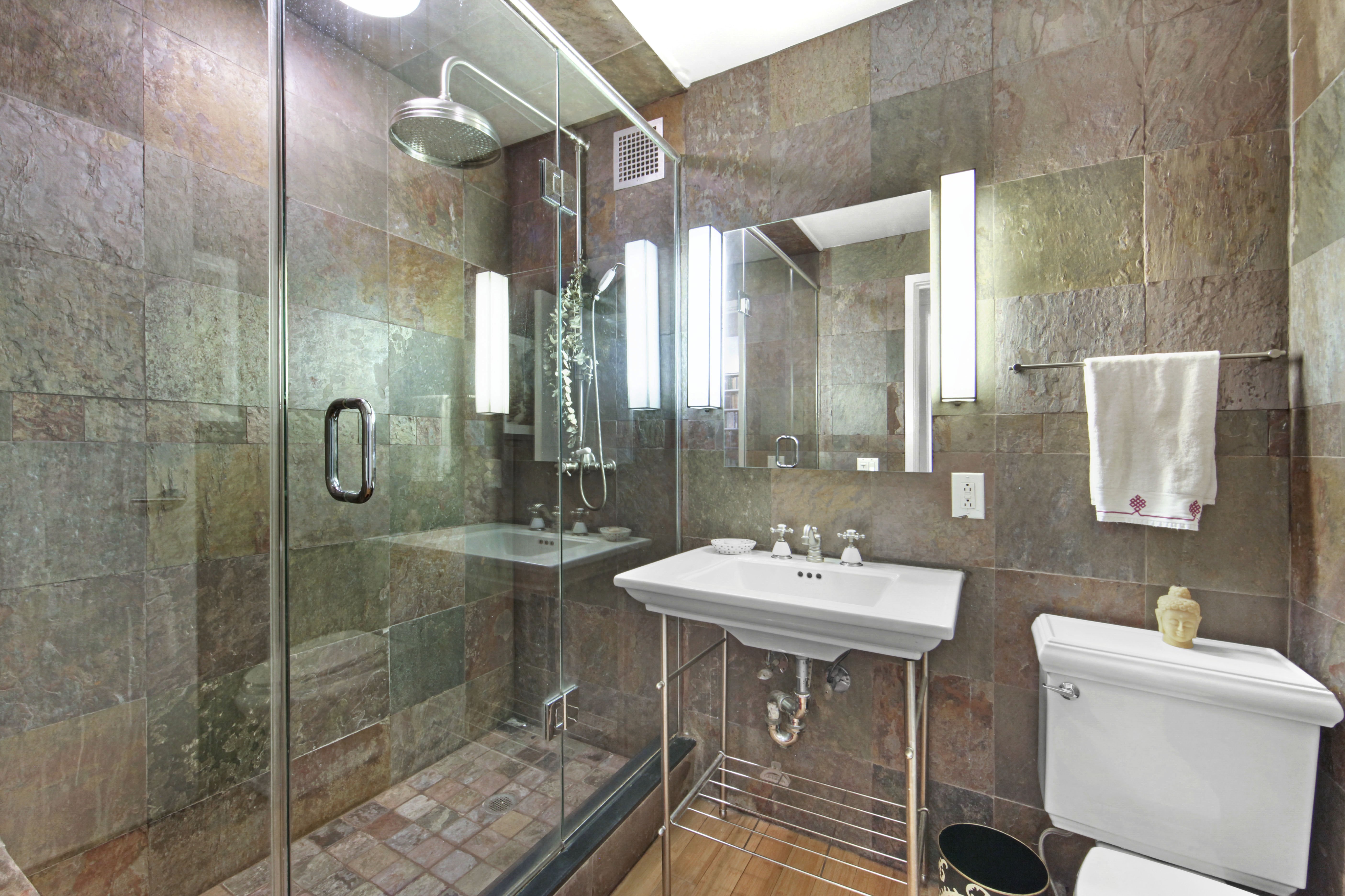 18 East 12th Street, Unit 7BC Manhattan, NY 10003 - Photo 19 of 26 a bathroom with a sink and a mirror