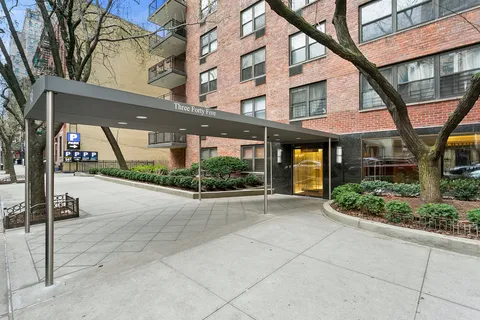 a view of a building with a tree