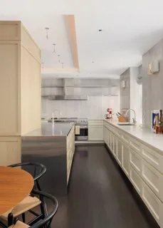 a kitchen with a sink appliances and cabinets